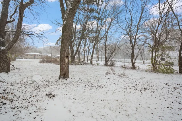 a view of snow on a road