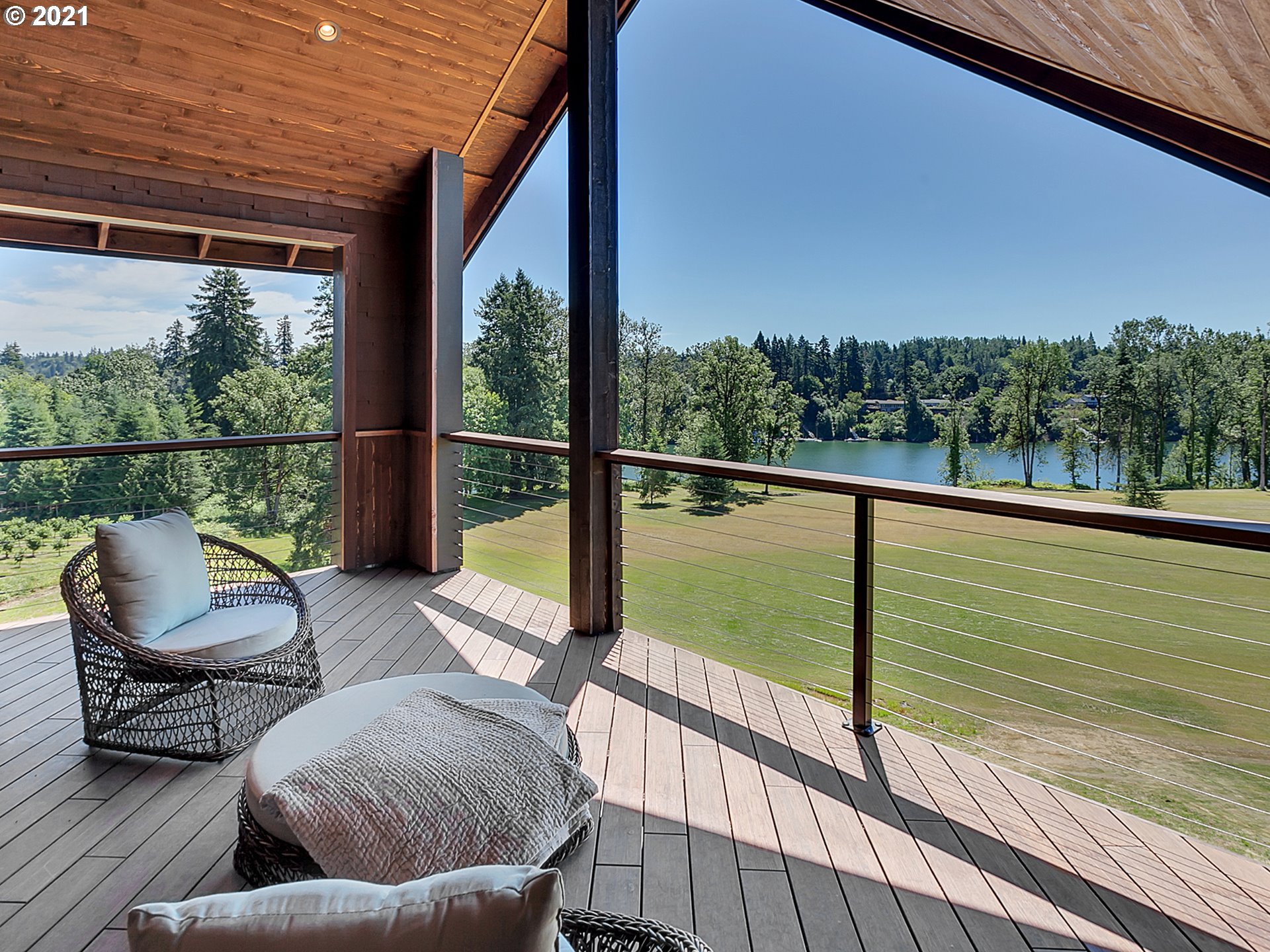 16096 Southwest Wilsonville Road Wilsonville, OR 97070 - Photo 16 of 32 a balcony with chairs and wooden floor