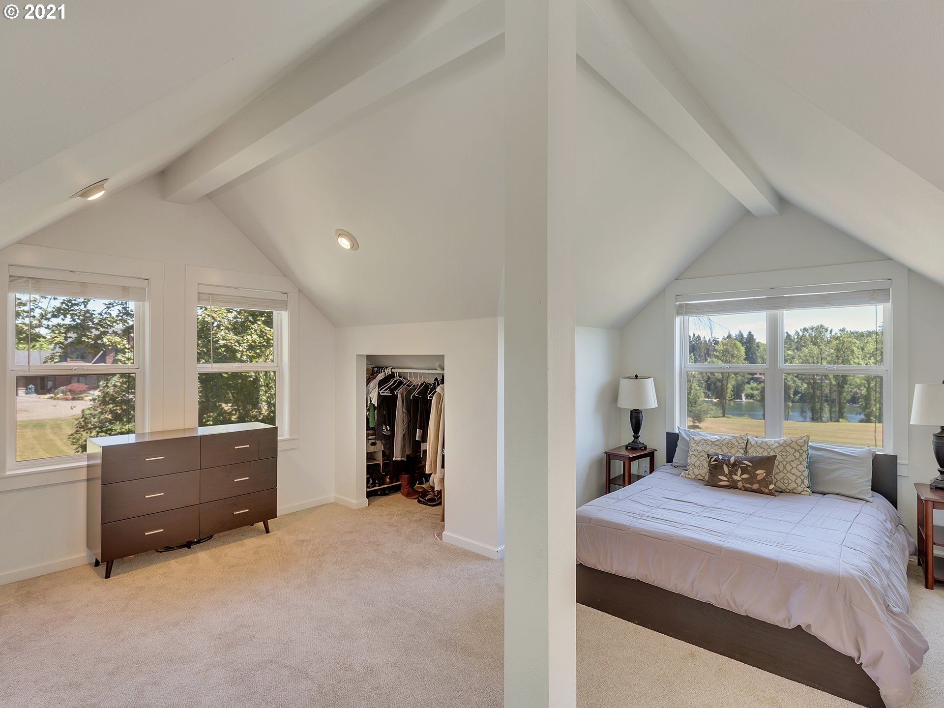 16096 Southwest Wilsonville Road Wilsonville, OR 97070 - Photo 30 of 32 a bedroom with a bed and a large window