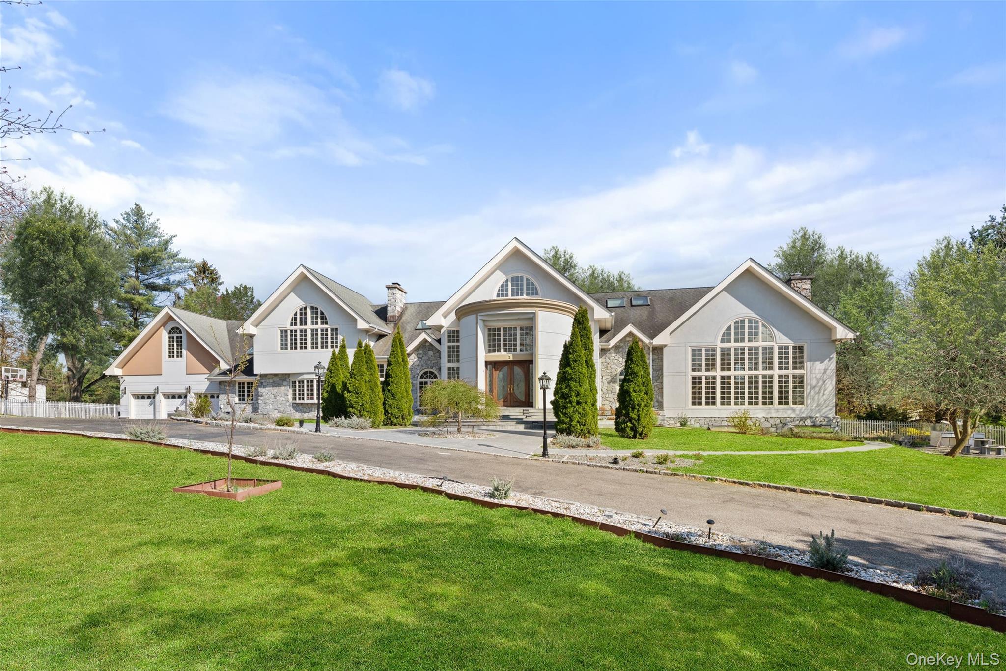 2 High Point Terrace Scarsdale, NY 10583 - Photo 1 of 42 a front view of a house with a yard and trees