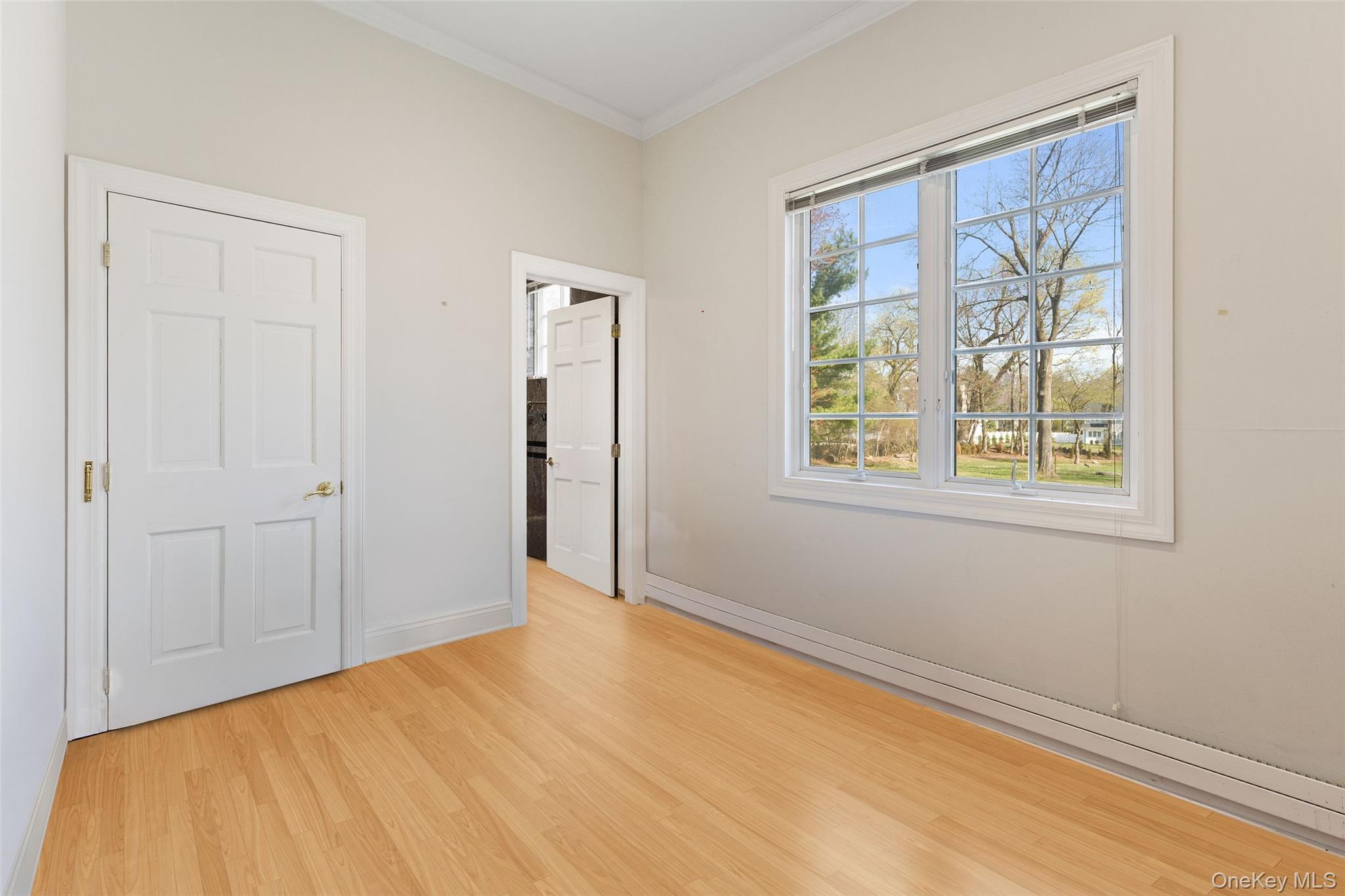 2 High Point Terrace Scarsdale, NY 10583 - Photo 11 of 42 1st floor bedroom featuring crown molding and light wood finished floors