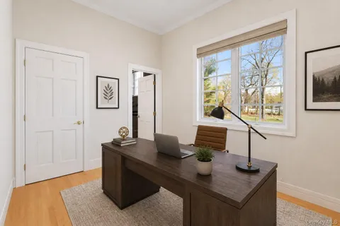 a spacious bedroom with a bed and a window