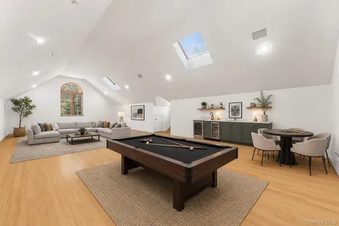 a spacious bedroom with a bed and a painting