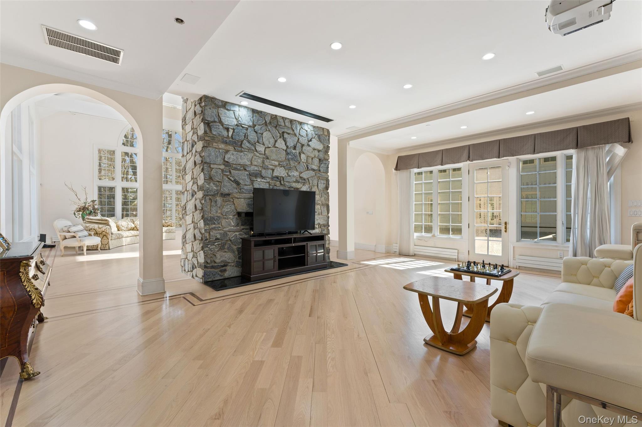 2 High Point Terrace Scarsdale, NY 10583 - Photo 2 of 42 a living room with furniture a flat screen tv and a large window