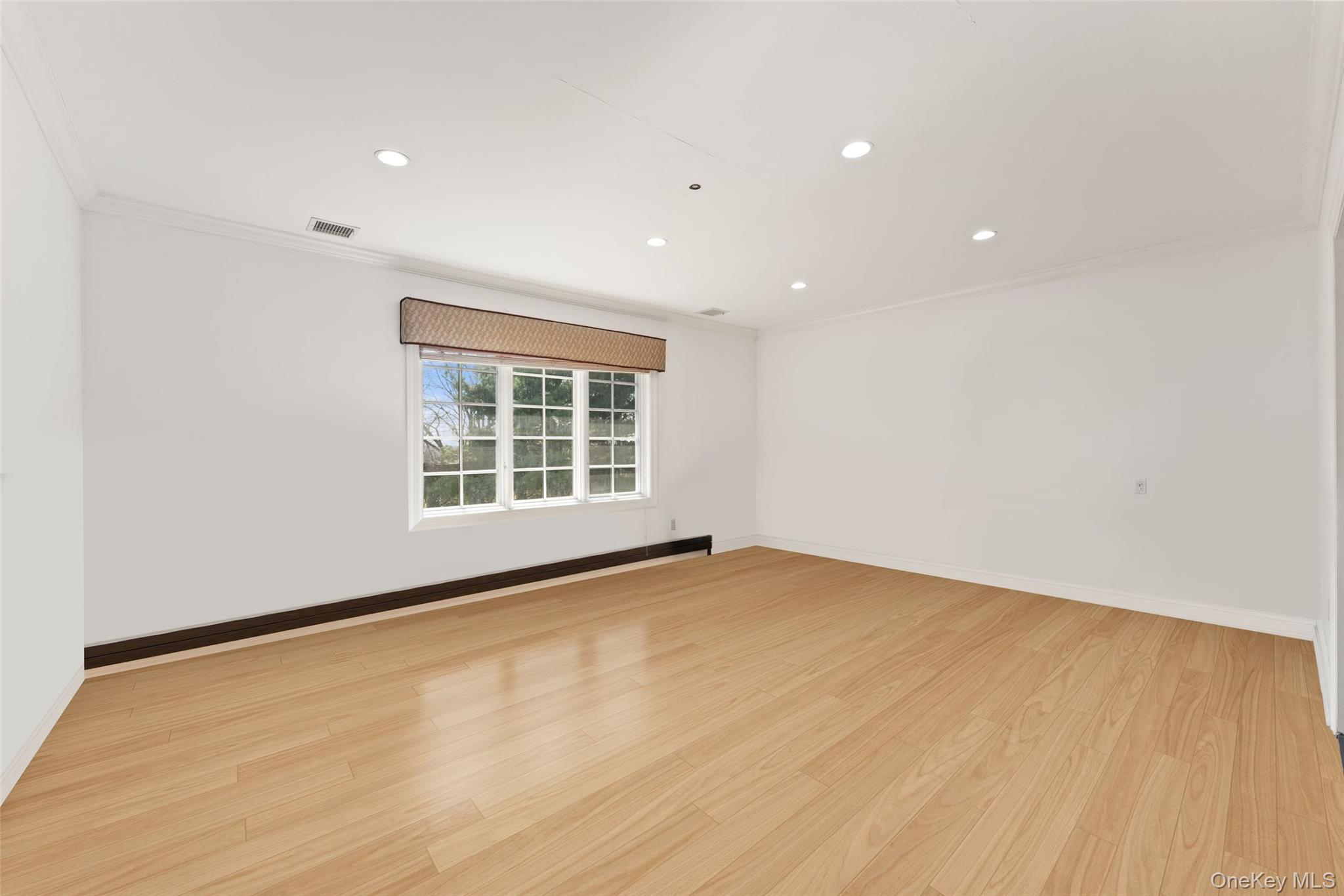 2 High Point Terrace Scarsdale, NY 10583 - Photo 28 of 42 a view of an empty room with wooden floor and a window