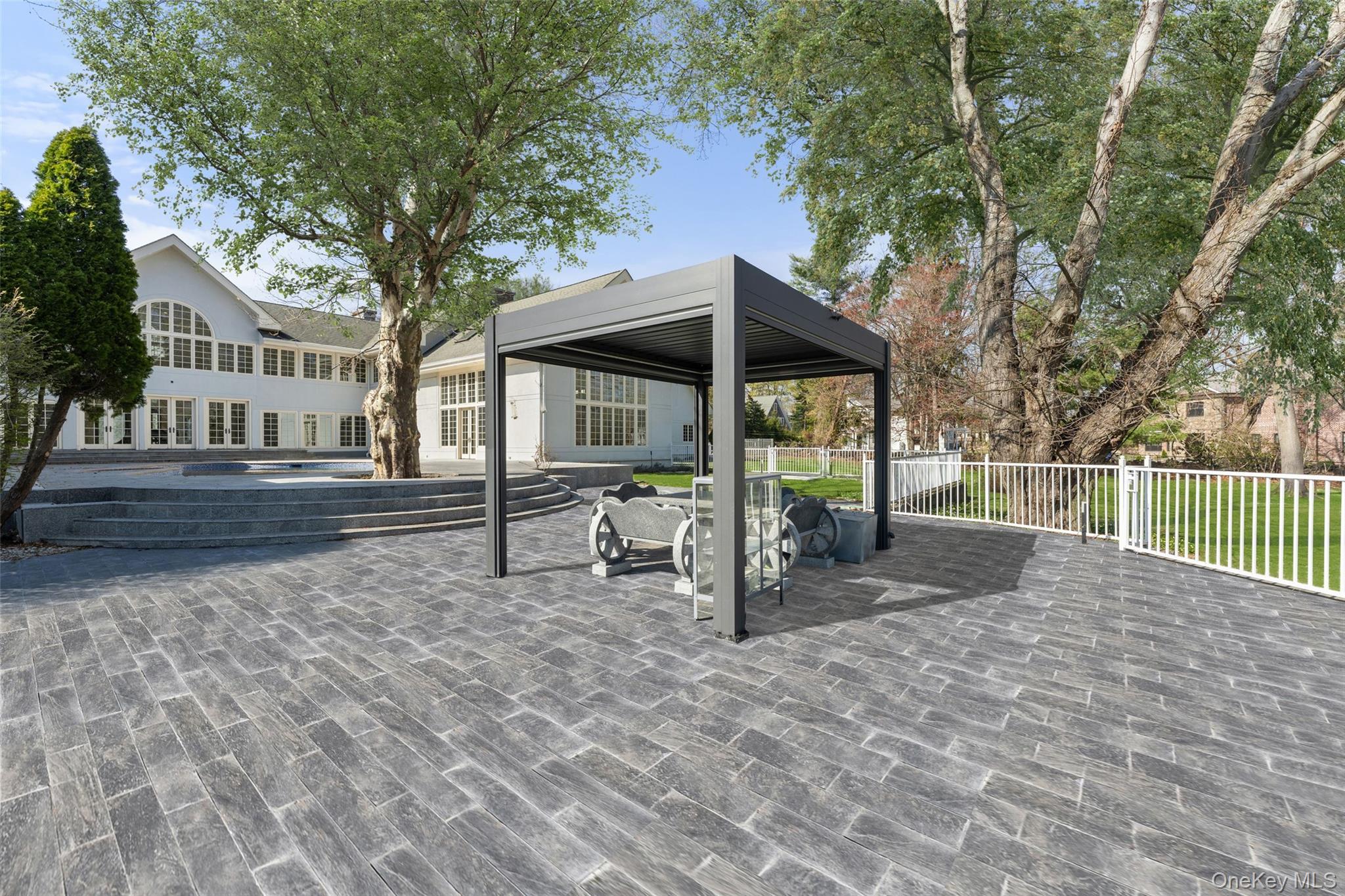 2 High Point Terrace Scarsdale, NY 10583 - Photo 33 of 42 a view of a house with a wooden deck and a large tree