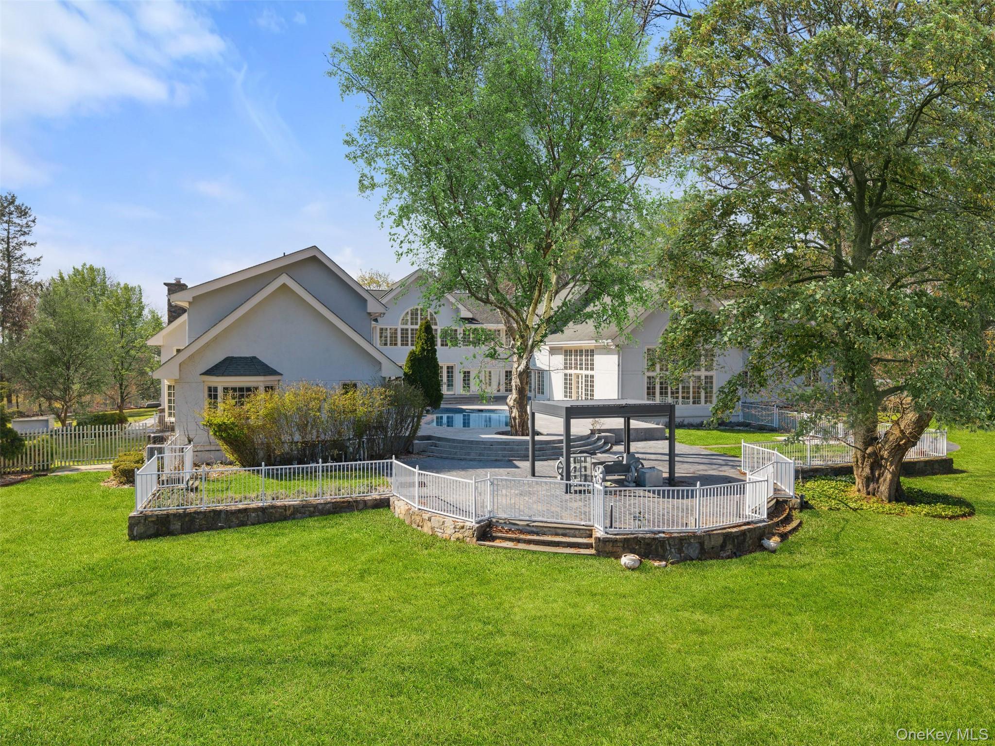 2 High Point Terrace Scarsdale, NY 10583 - Photo 34 of 42 a view of house with a big yard and large trees