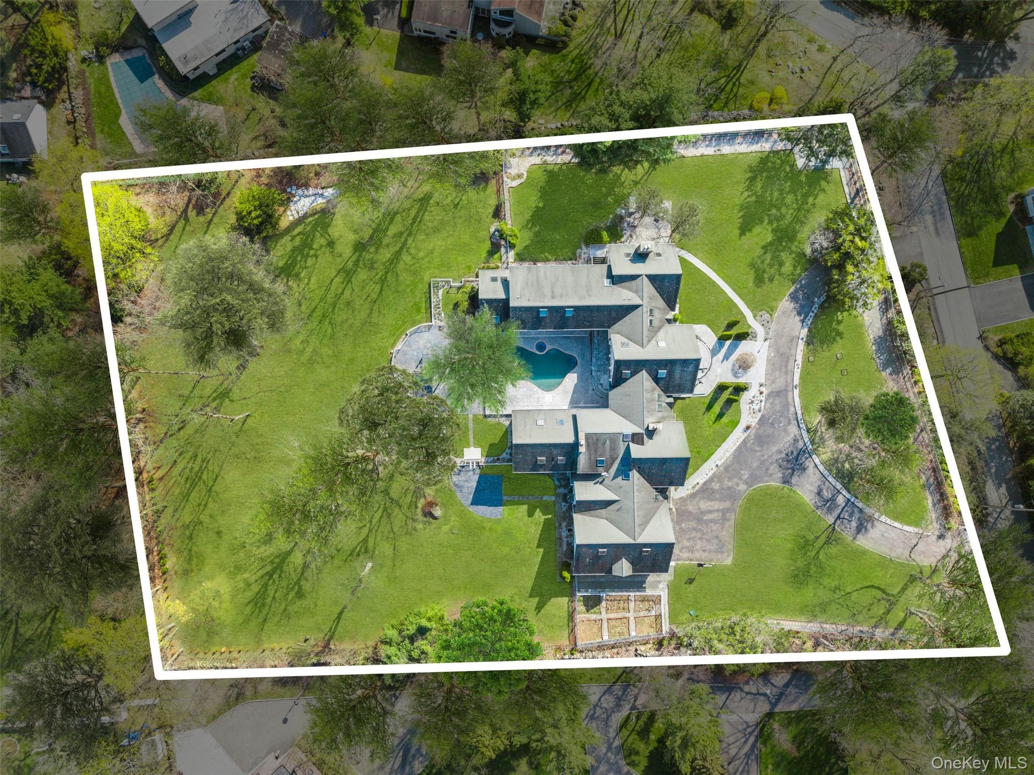 2 High Point Terrace Scarsdale, NY 10583 - Photo 37 of 42 an aerial view of a house with pool outdoor seating and yard
