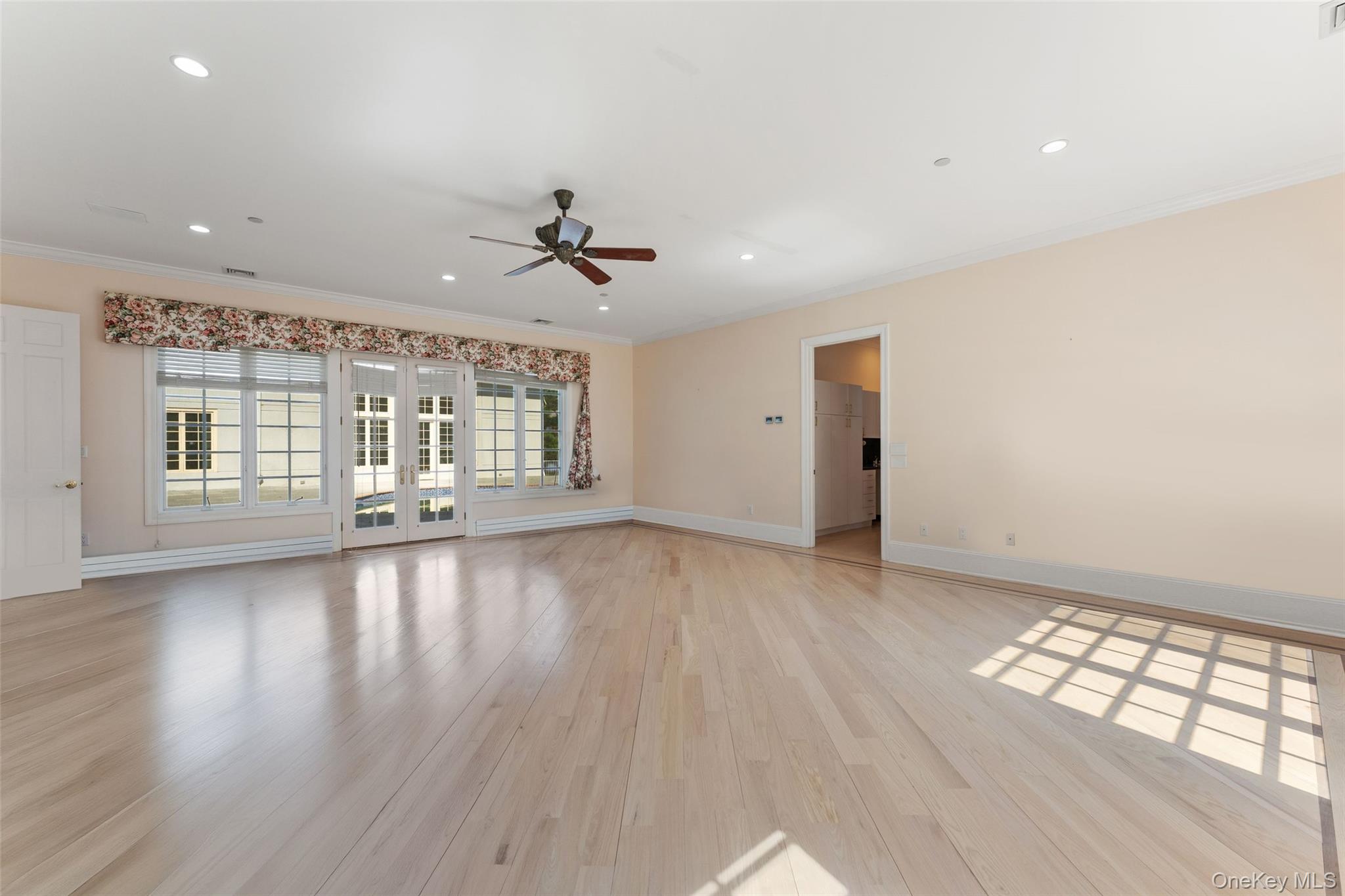 2 High Point Terrace Scarsdale, NY 10583 - Photo 10 of 42 a view of an empty room with a window and wooden floor