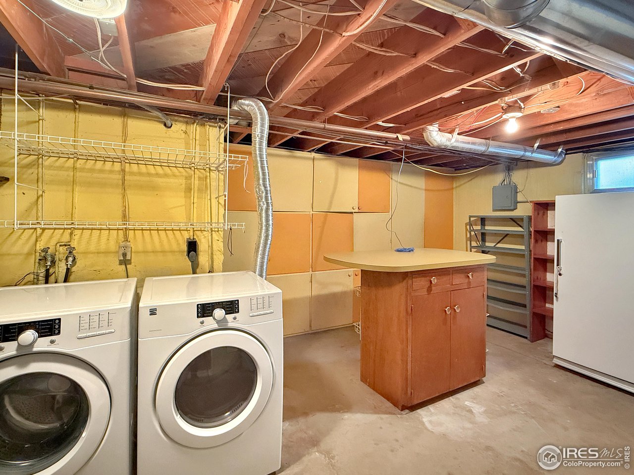 508 Fairhurst Street Sterling, CO 80751 - Photo 32 of 39 a view of a storage & utility room with washer and dryer