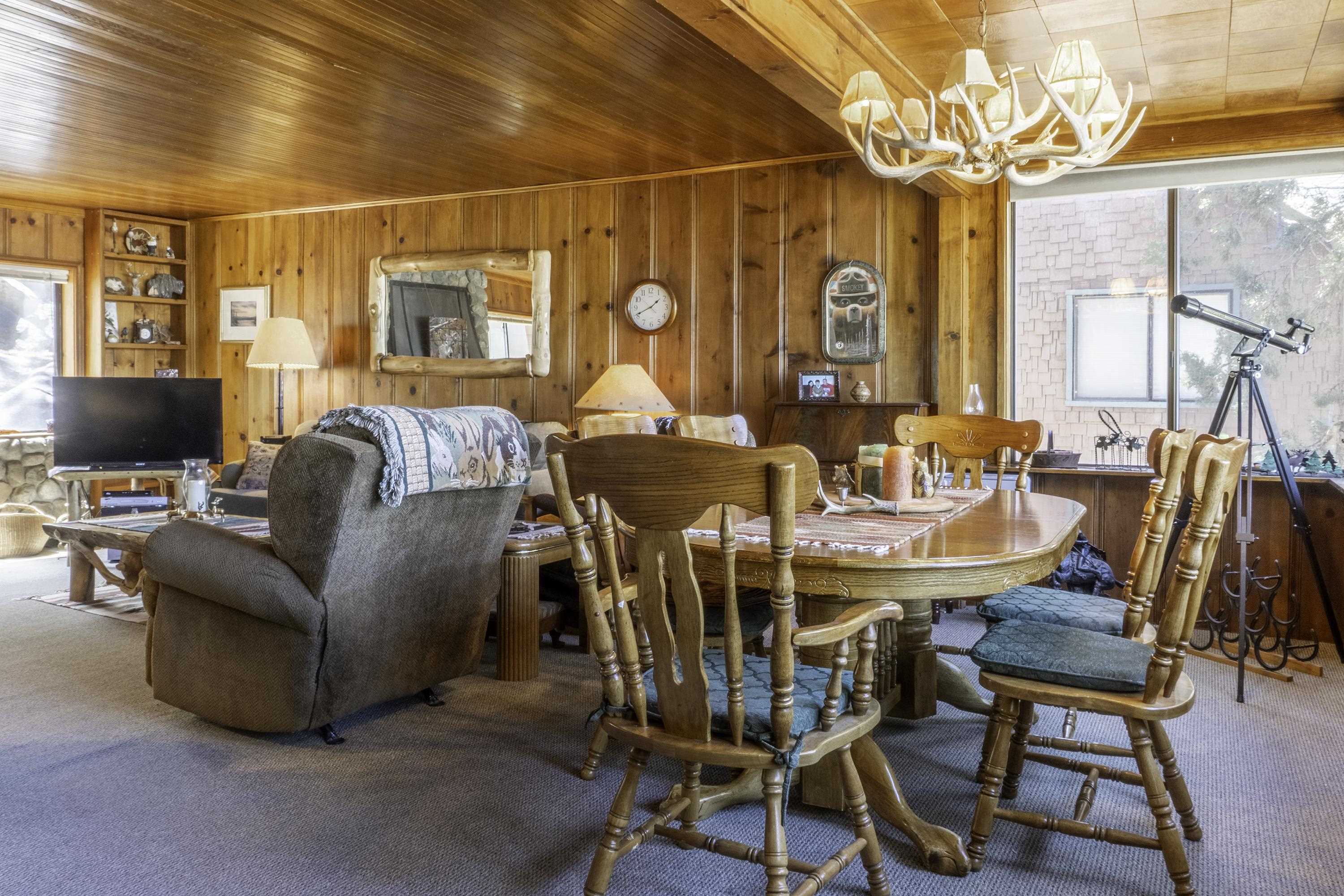64 Frst Knl Road, Unit 47 June Lake, CA 93529 - Photo 6 of 34 a dining room with furniture and wooden floor