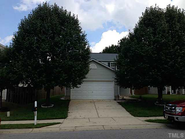 5841 Bryanstone Place Raleigh, NC 27610 - Photo 23 of 23 a view of a street with a bench and trees