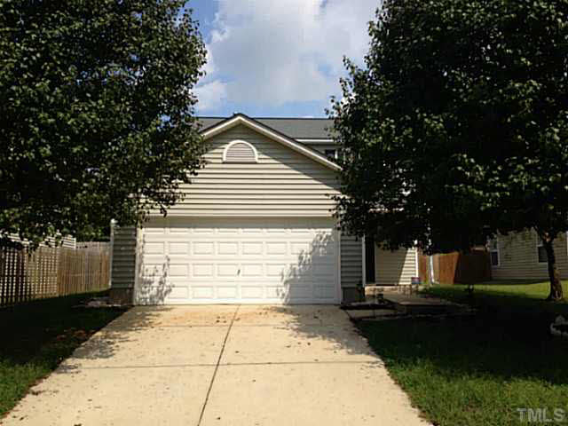 5841 Bryanstone Place Raleigh, NC 27610 - Photo 3 of 23 a front view of a house with a yard
