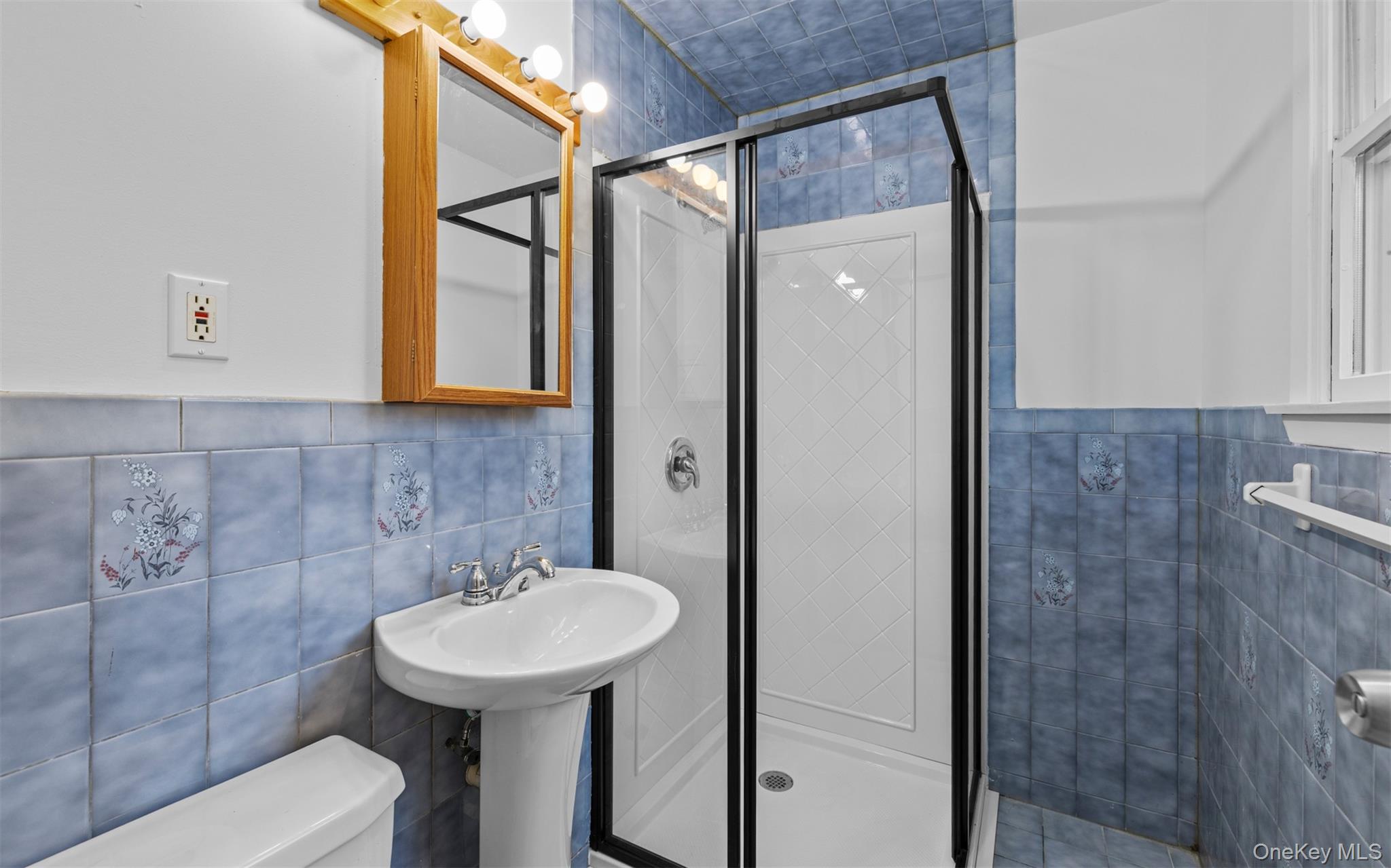 37 Pond Lane Ridge, NY 11961 - Photo 14 of 26 a bathroom with a sink toilet and shower