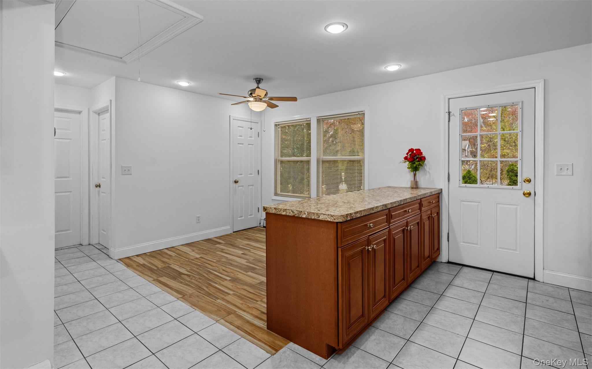 37 Pond Lane Ridge, NY 11961 - Photo 20 of 26 a kitchen with granite countertop a sink and a stove