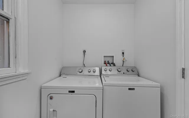 a utility room with dryer and washer