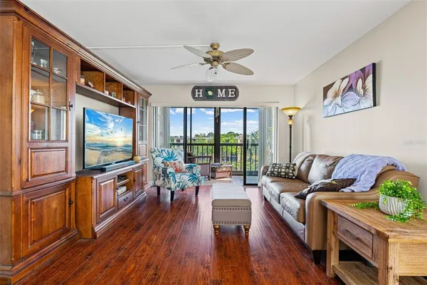 a bedroom with furniture and large windows