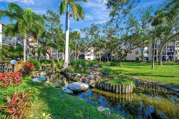 a view of a chairs and tables in the garden