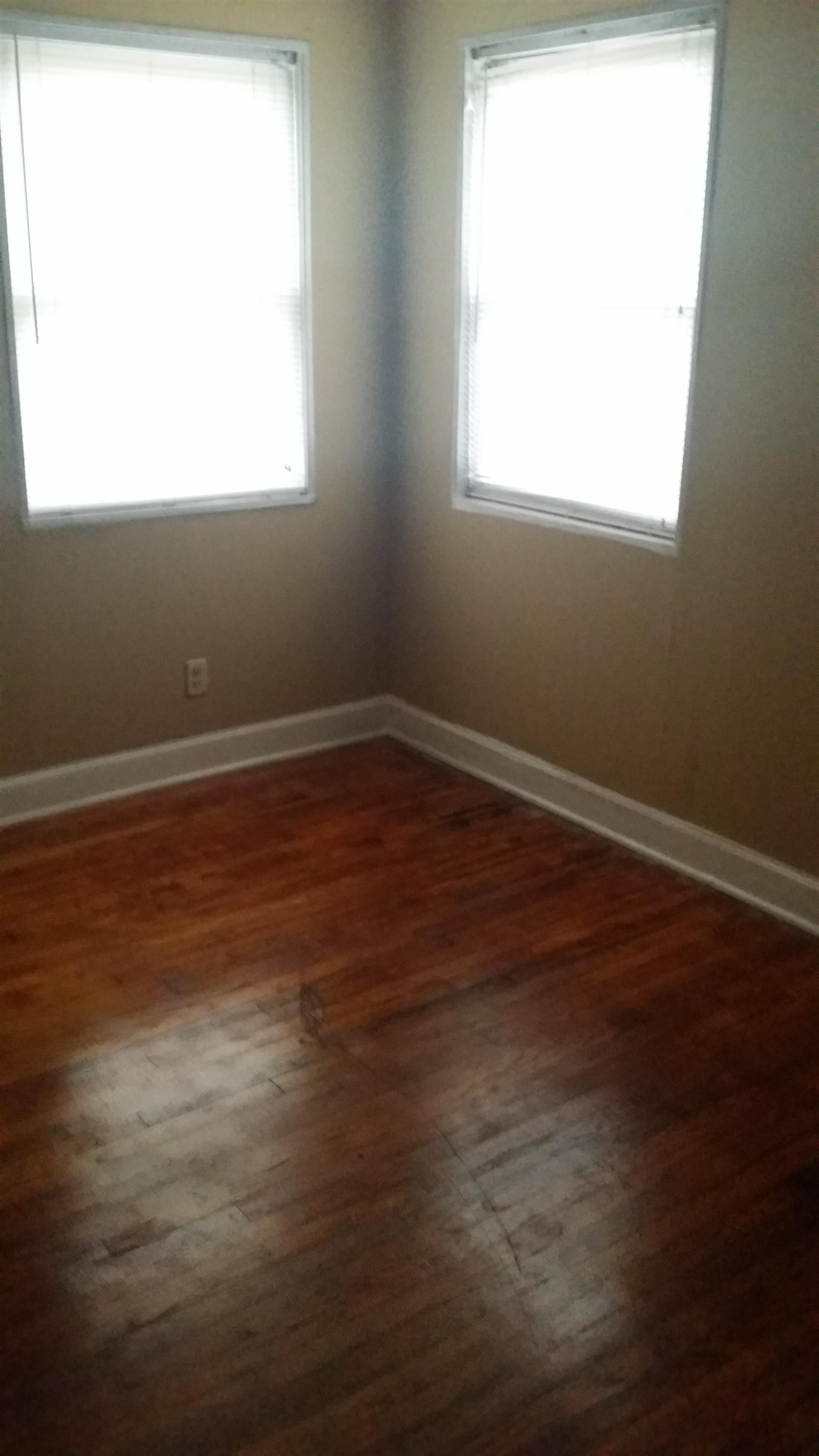 2023 Brighton Road Memphis, TN 38128 - Photo 14 of 21 an empty room with wooden floor and a window