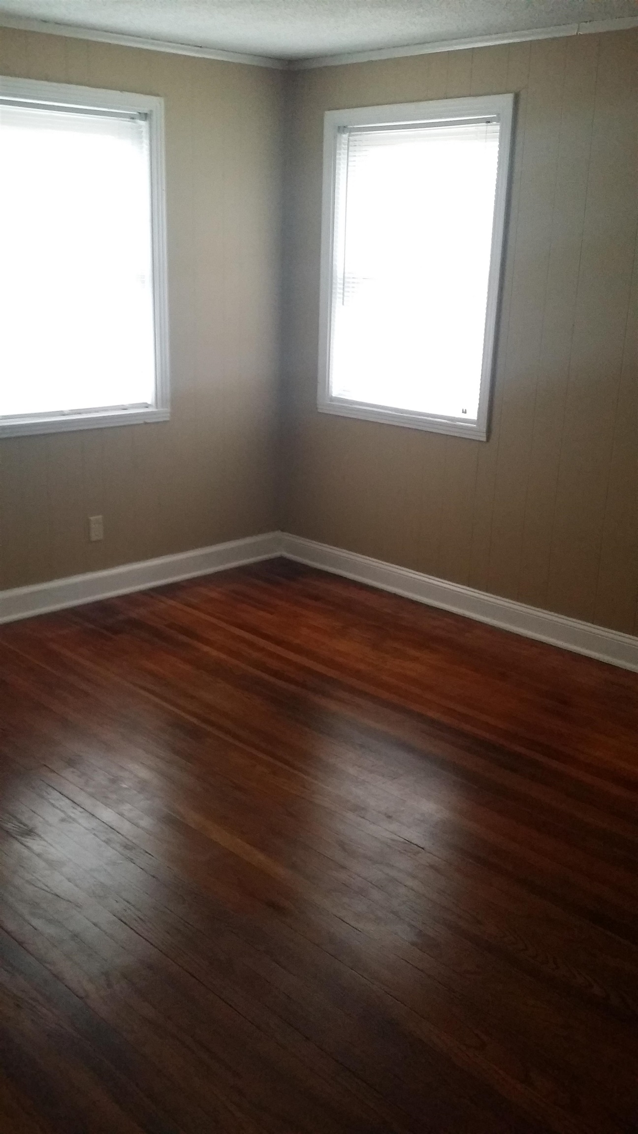 2023 Brighton Road Memphis, TN 38128 - Photo 17 of 21 an empty room with wooden floor and windows