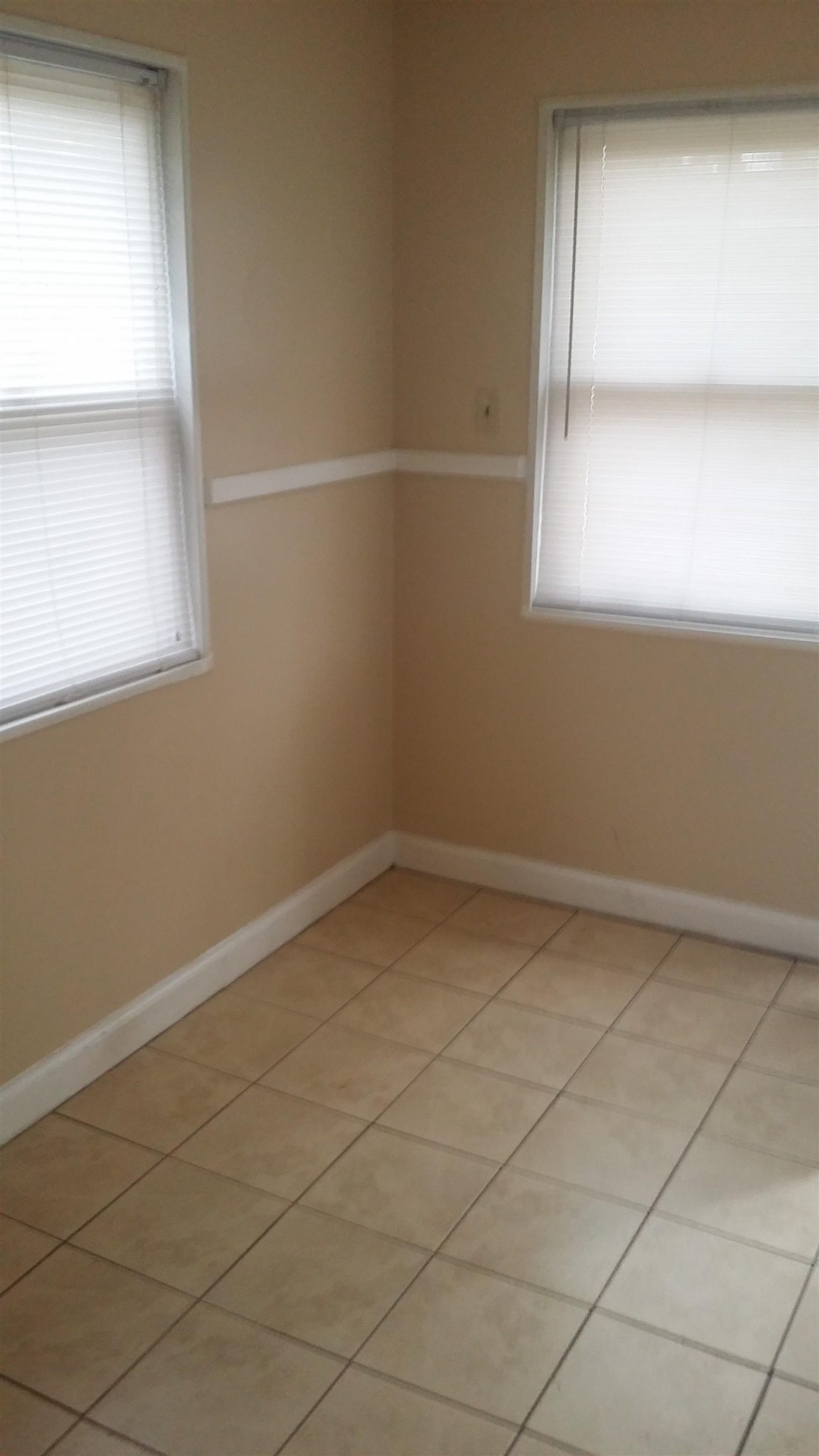 2023 Brighton Road Memphis, TN 38128 - Photo 19 of 21 Empty room featuring light tile patterned flooring and healthy amount of natural light