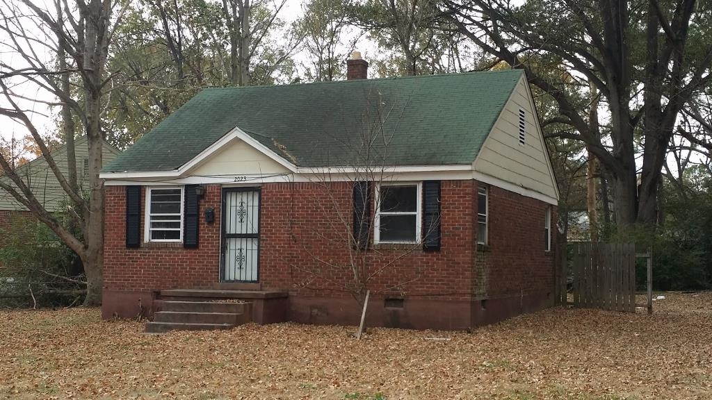 2023 Brighton Road Memphis, TN 38128 - Photo 2 of 21 a front view of a house with a garden