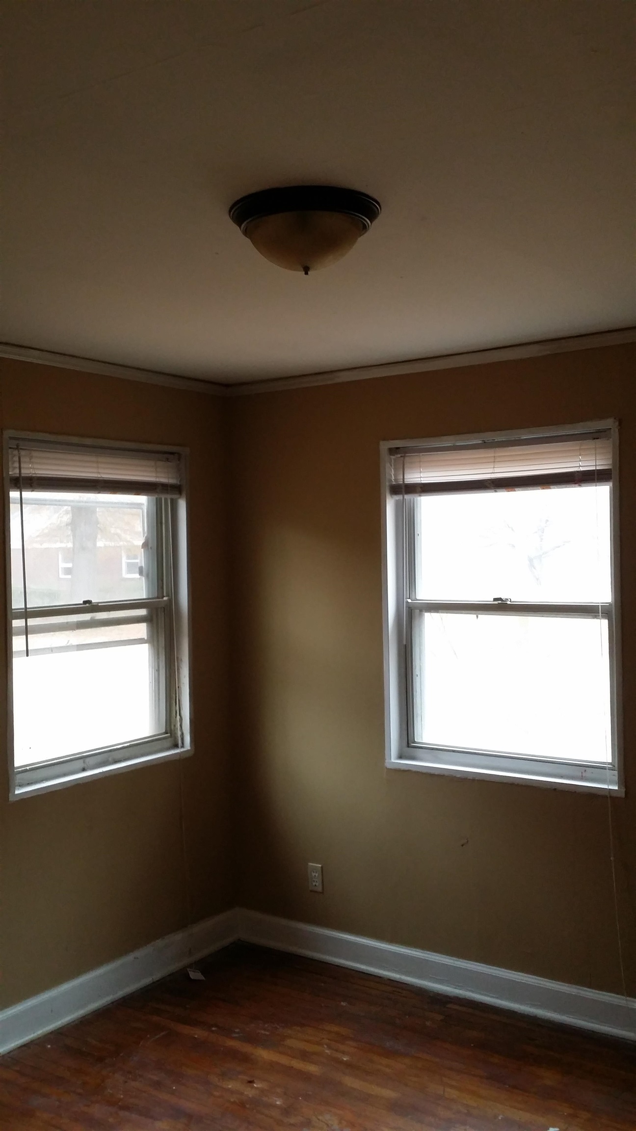 2023 Brighton Road Memphis, TN 38128 - Photo 10 of 21 a view of an empty room with wooden floor and a window