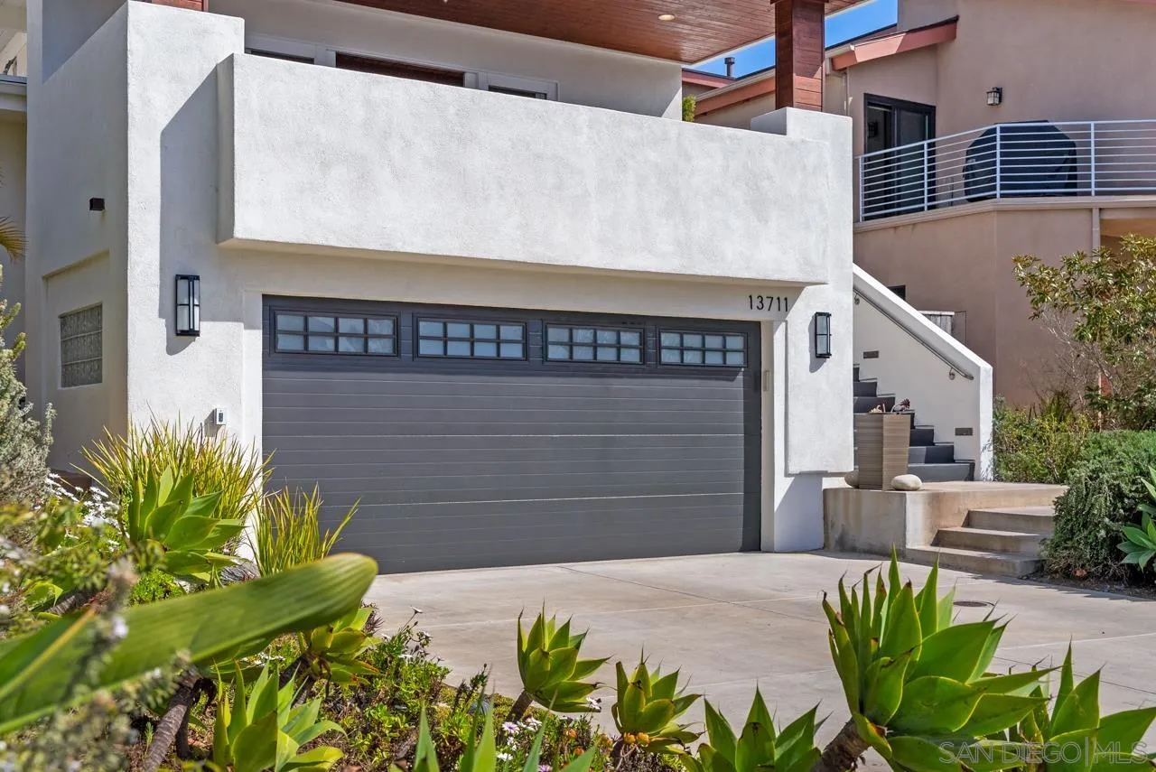 13711 Mercado Drive Del Mar, CA 92014 - Photo 2 of 46 a sign that is on the side of a building