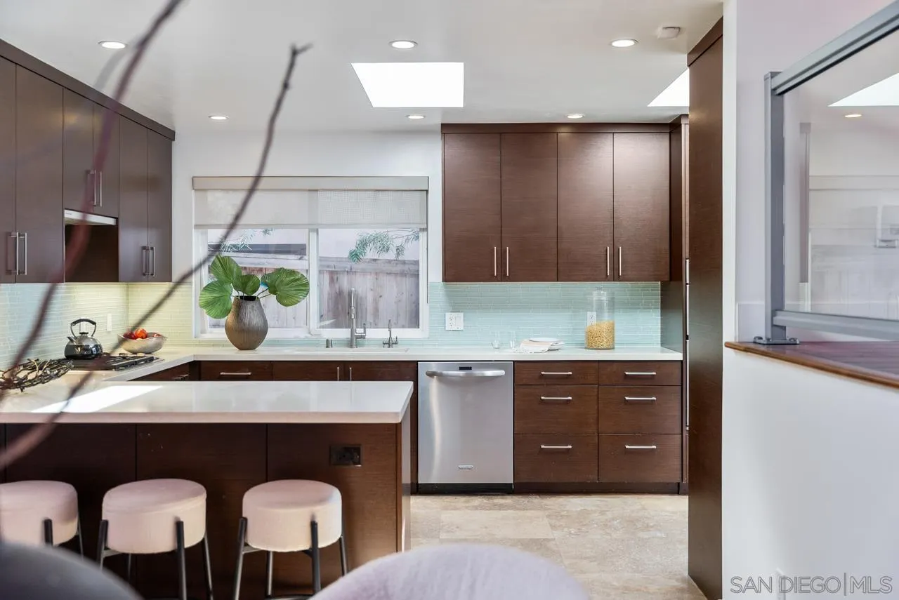 13711 Mercado Drive Del Mar, CA 92014 - Photo 22 of 46 a kitchen with a sink and cabinets
