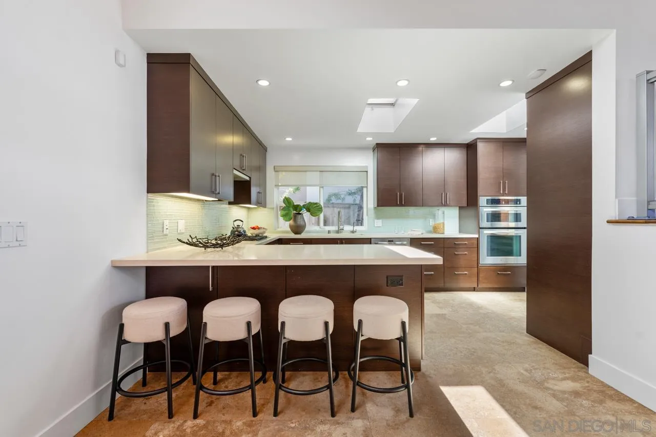 13711 Mercado Drive Del Mar, CA 92014 - Photo 23 of 46 a dining room with furniture and a large window