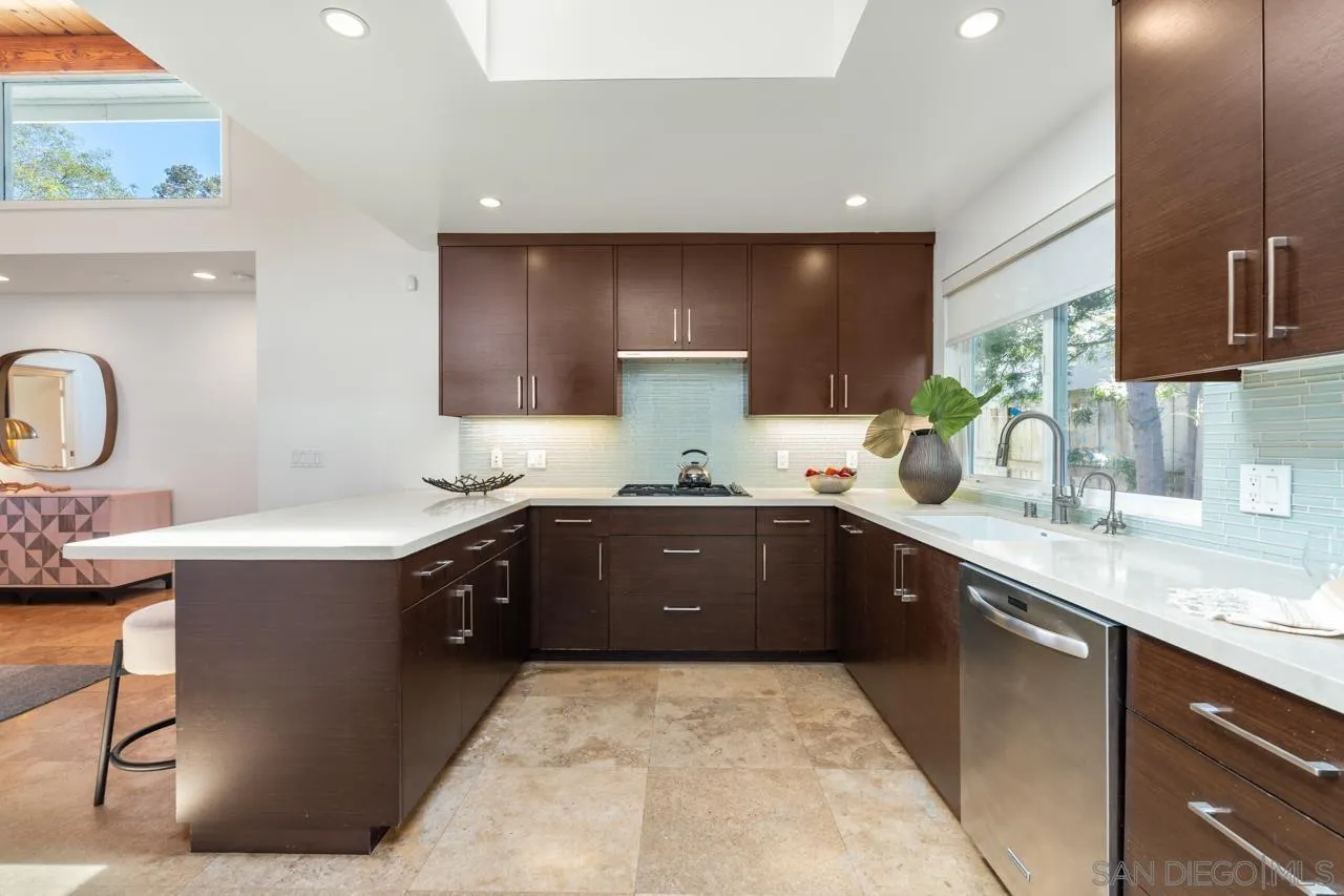 13711 Mercado Drive Del Mar, CA 92014 - Photo 24 of 46 a kitchen with granite countertop a sink stainless steel appliances and cabinets