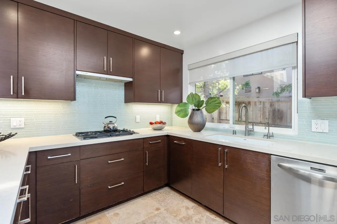 13711 Mercado Drive Del Mar, CA 92014 - Photo 25 of 46 a kitchen with a sink and cabinets