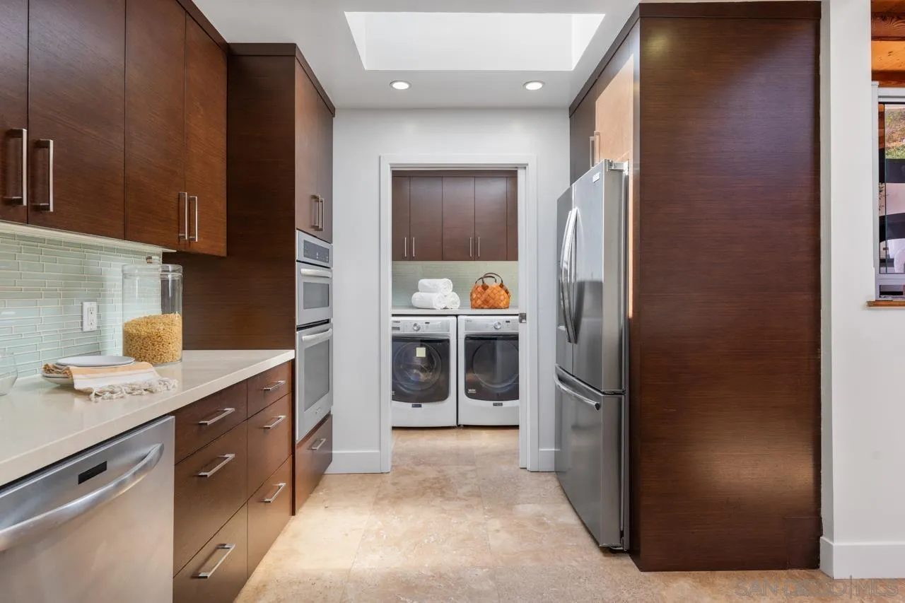 13711 Mercado Drive Del Mar, CA 92014 - Photo 26 of 46 a kitchen with a refrigerator and a sink