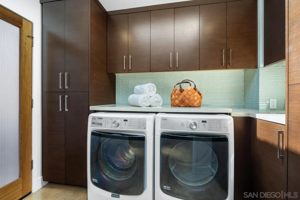 13711 Mercado Drive Del Mar, CA 92014 - Photo 27 of 46 a utility room with dryer and washer