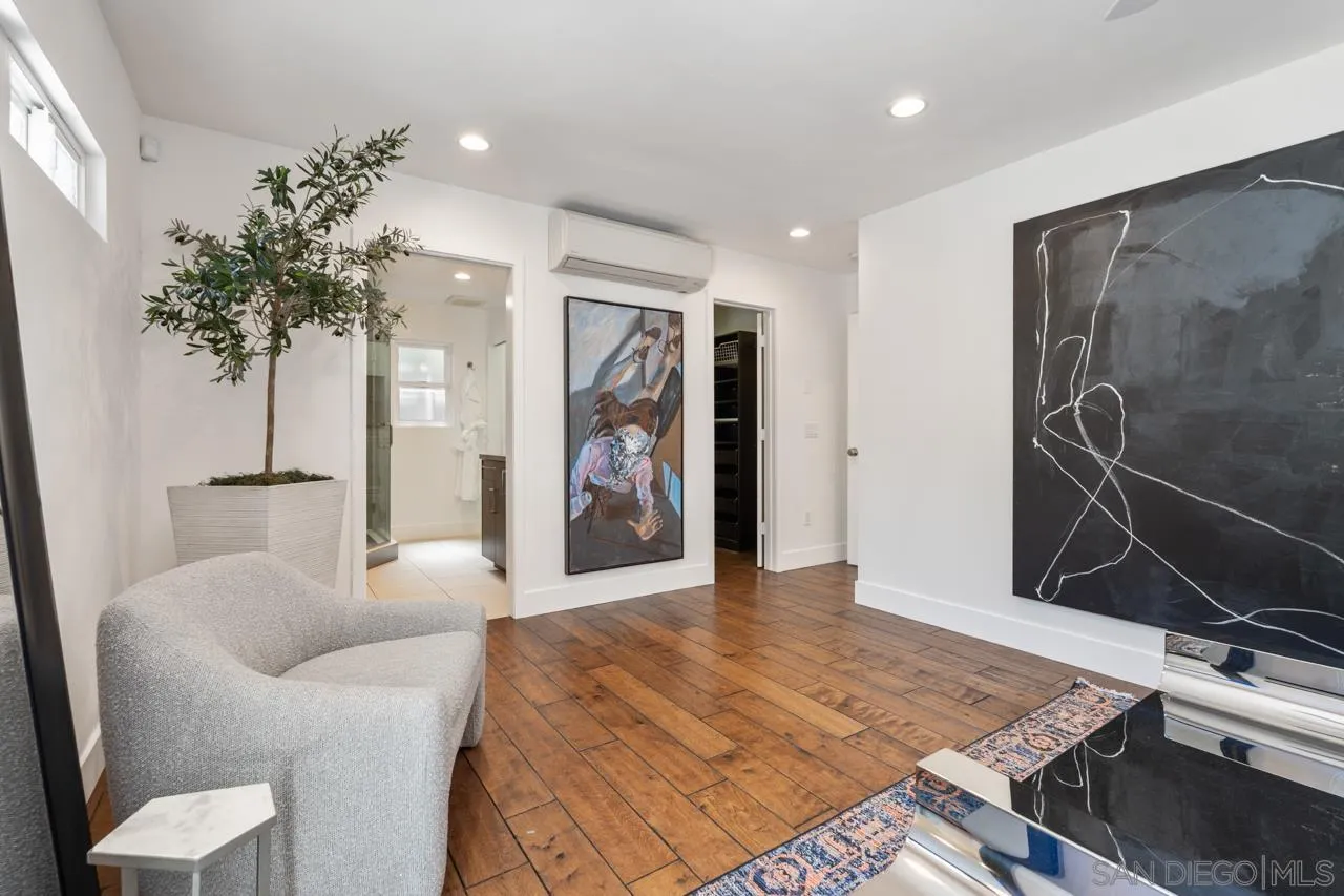 13711 Mercado Drive Del Mar, CA 92014 - Photo 31 of 46 a living room with furniture and a potted plant
