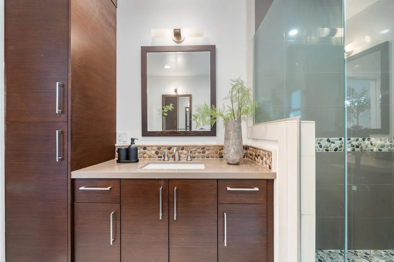 13711 Mercado Drive Del Mar, CA 92014 - Photo 33 of 46 a bathroom with a sink vanity and a mirror