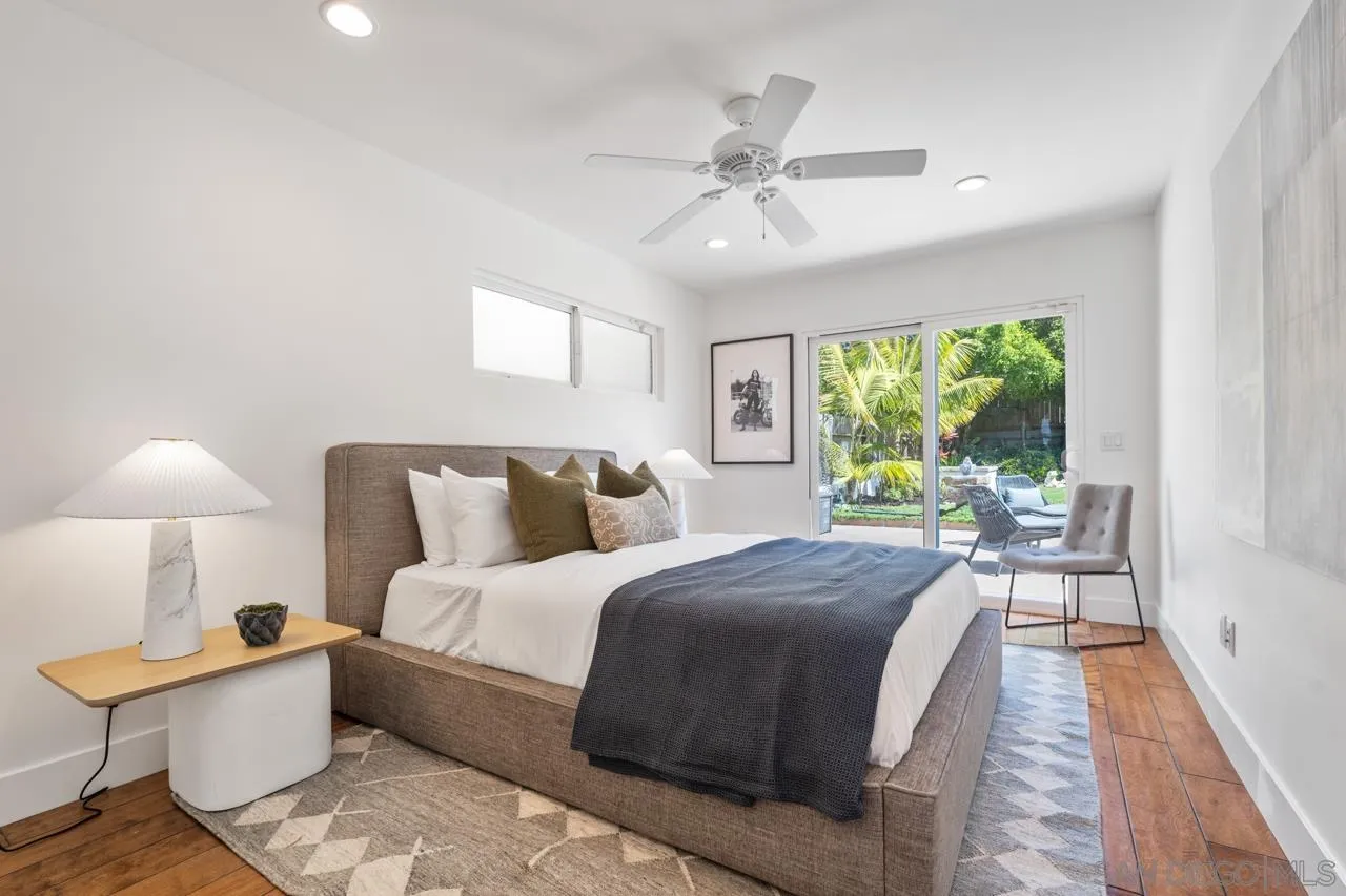 13711 Mercado Drive Del Mar, CA 92014 - Photo 39 of 46 a large bedroom with a bed and a large window