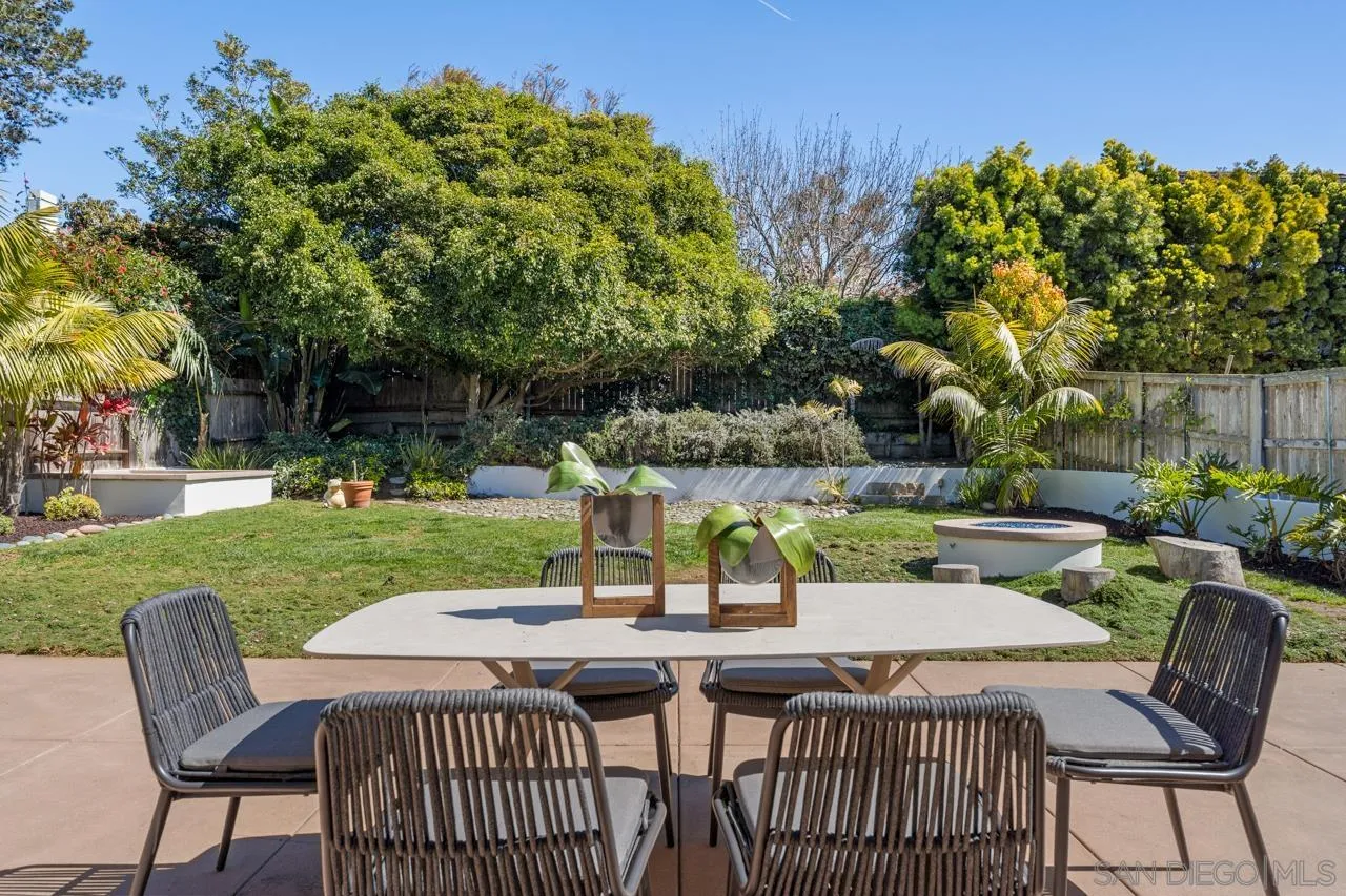 13711 Mercado Drive Del Mar, CA 92014 - Photo 41 of 46 a view of a table and chairs in patio with wooden fence