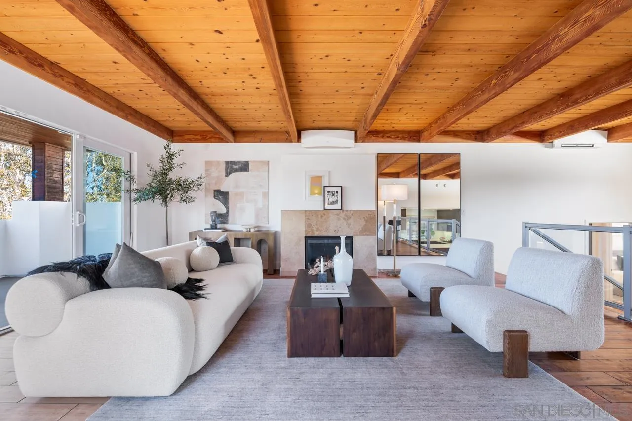 13711 Mercado Drive Del Mar, CA 92014 - Photo 6 of 46 a living room with furniture a fireplace and a table