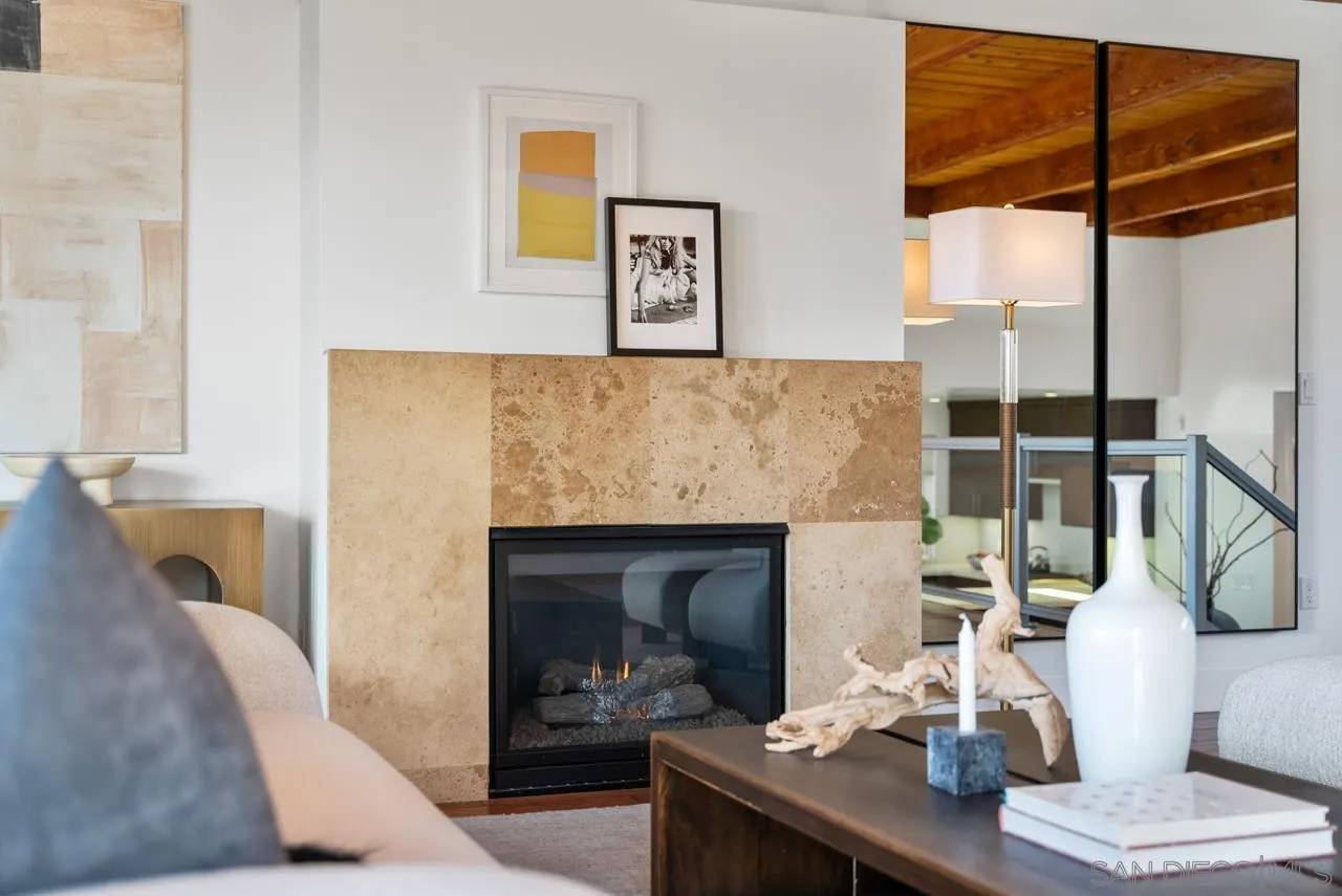 13711 Mercado Drive Del Mar, CA 92014 - Photo 7 of 46 a living room with furniture a large window and a fireplace
