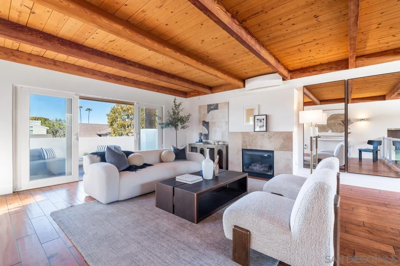 13711 Mercado Drive Del Mar, CA 92014 - Photo 9 of 46 a living room with furniture a fireplace and a table