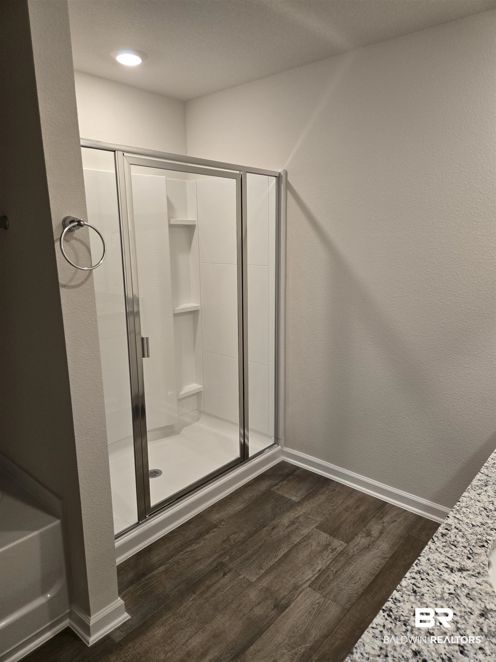 24194 Veranda Circle Elberta, AL 36530 - Photo 27 of 31 Bathroom featuring hardwood / wood-style floors and a shower with door