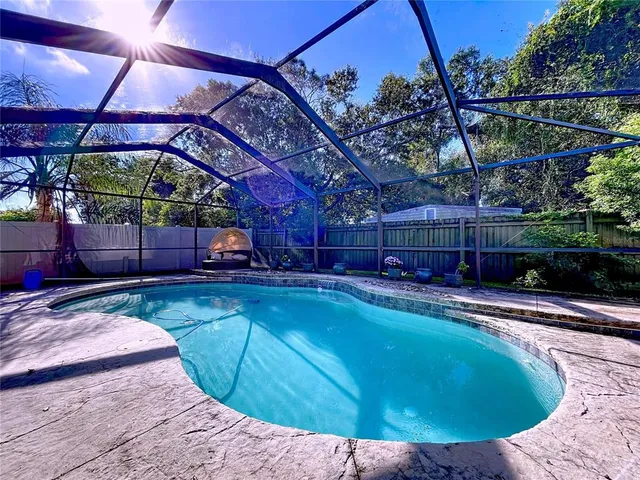 a view of a swimming pool with a patio