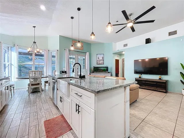 a bedroom with a bed and a dresser next to a window