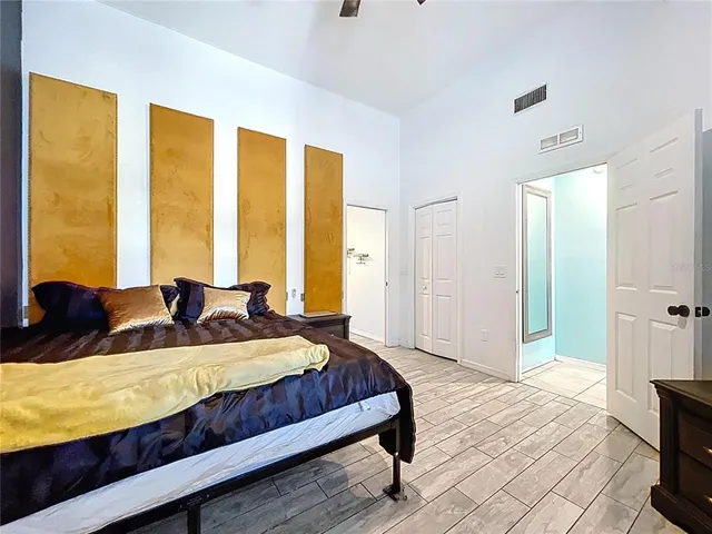 a bathroom with a toilet a sink a mirror and vanity