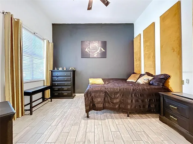 a view of a hallway and a livingroom with furniture