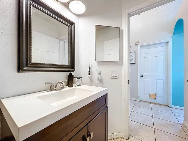 a bedroom with a bed and cabinets