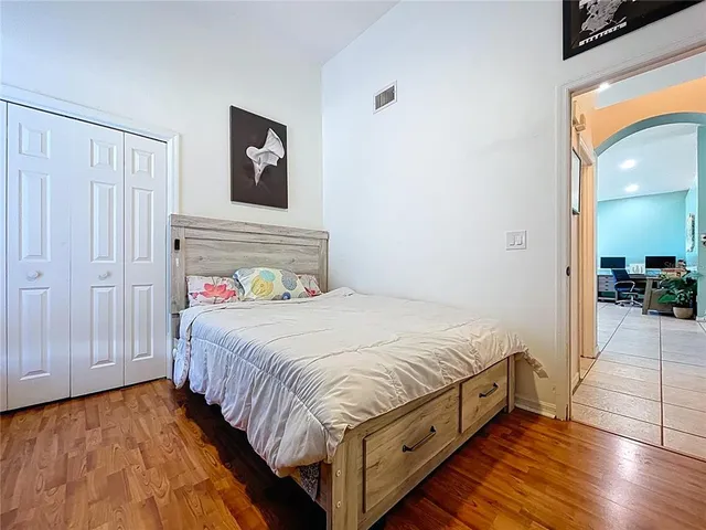 a en suite bathroom with a granite countertop sink and a mirror