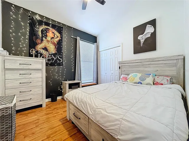 a bed sitting in a room next to a window