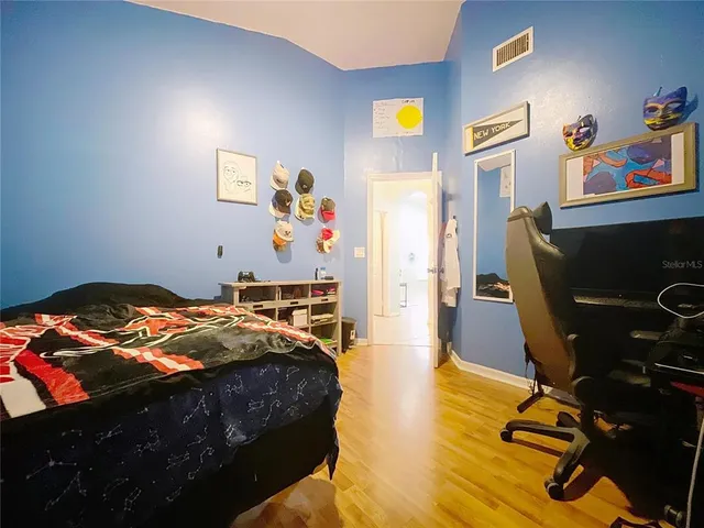 a view of a patio with table and chairs potted plants with wooden floor